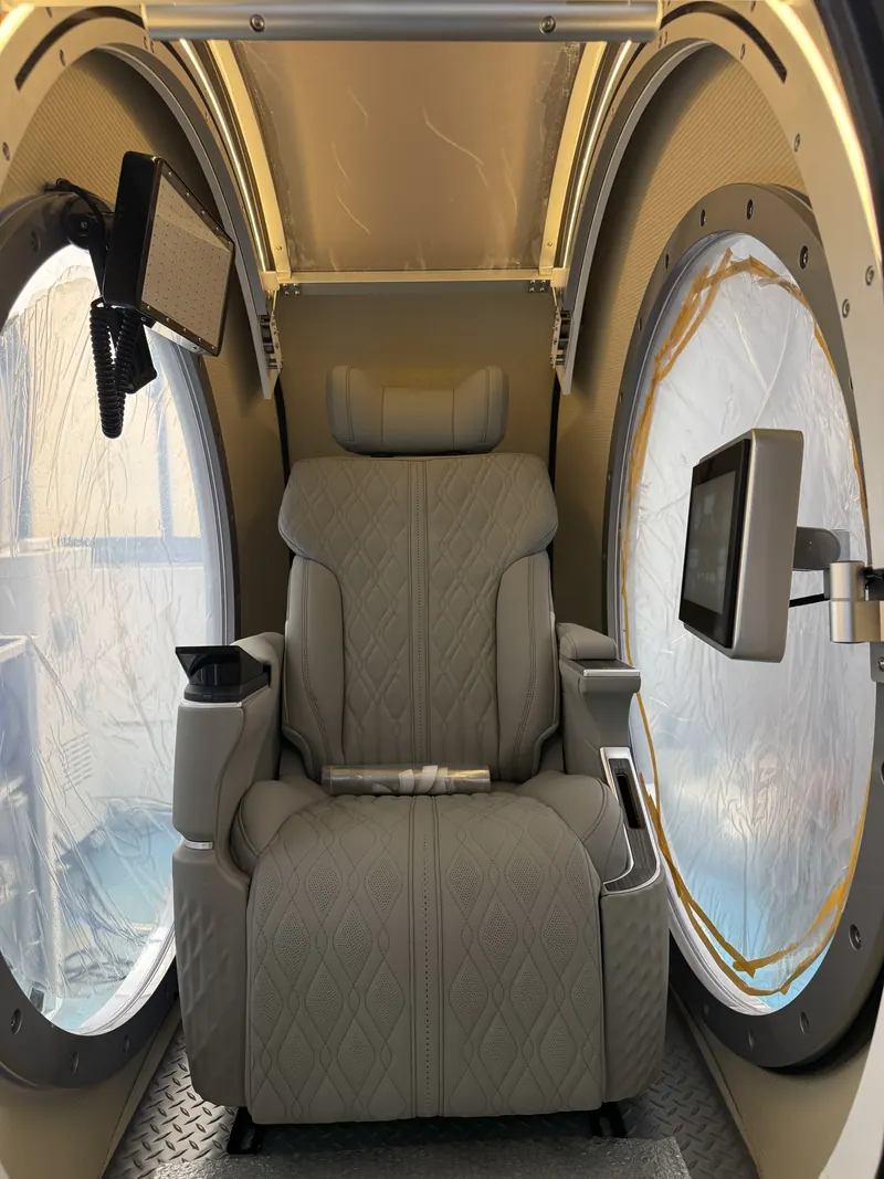 Seat between the two side windows