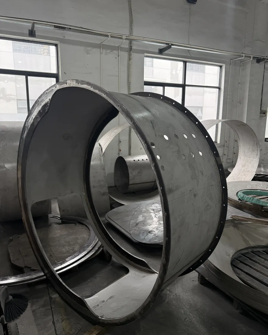 Steel shell ring after welding, door opening cut