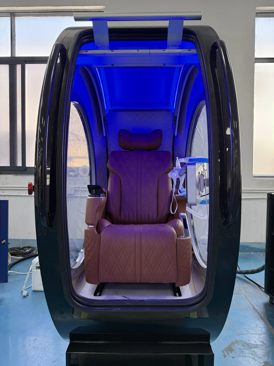 Black ARC interior under blue light, door open